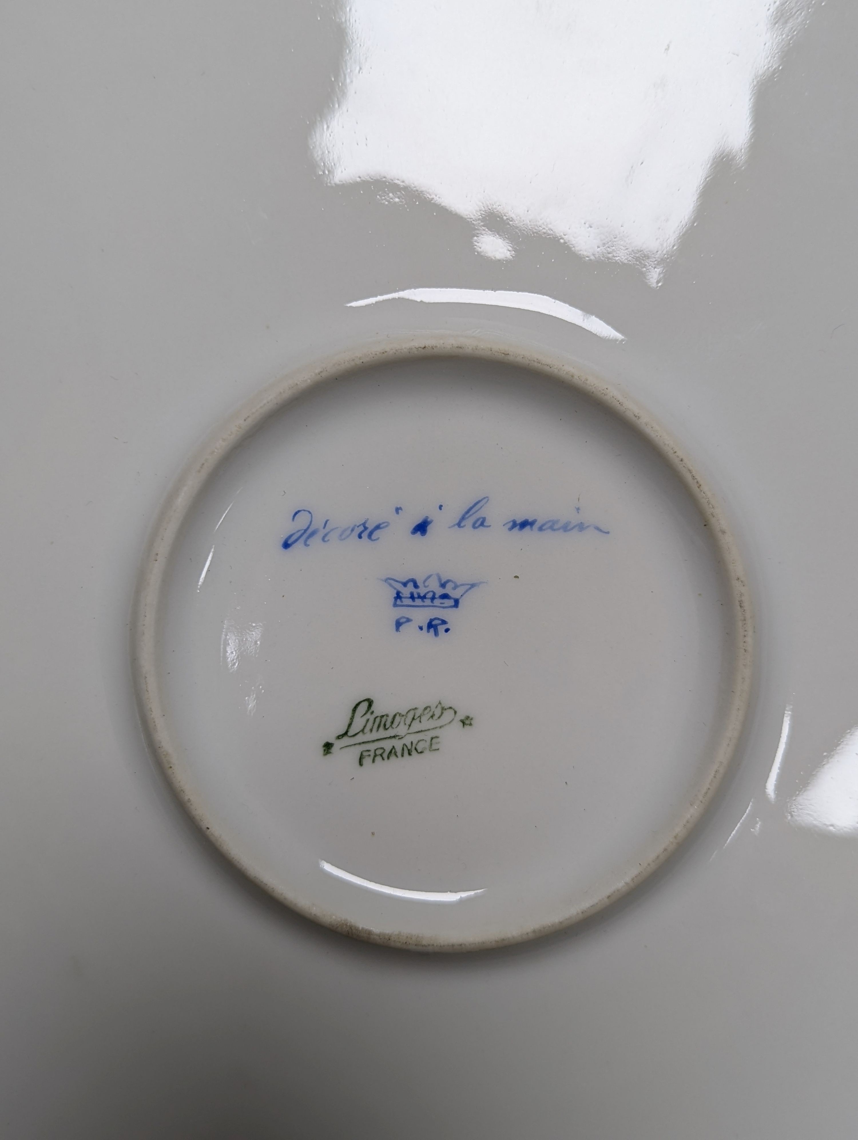 A Sevres style boat shaped dish and a Limoges circular dish, Sevres dish 27 cms wide & Limoges dish 31 cms diameter.
